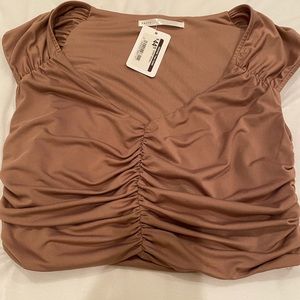 Woman’s beige ruffle crop top